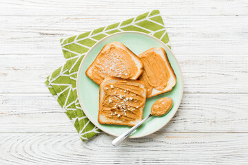 Peanut butter sandwiches or toasts on light table background.Breakfast. Vegetarian food. American cuisine top view vith copy space