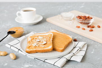 Peanut butter sandwiches or toasts on light table background.Breakfast. Vegetarian food. American cuisine top view vith copy space