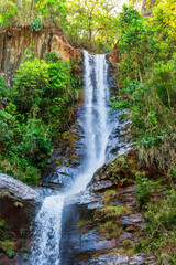 Fototapeta na wymiar Rocks and waterfall in the forest vegetation of the state of Minas Gerais, Brazil