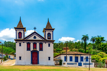 Fototapeta na wymiar Small historic church in baroque style located in a remote village in the state of Minas Gerais called Morro Vermelho