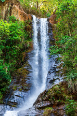 Obraz premium Waterfall in the forest vegetation of the state of Minas Gerais, Brazil