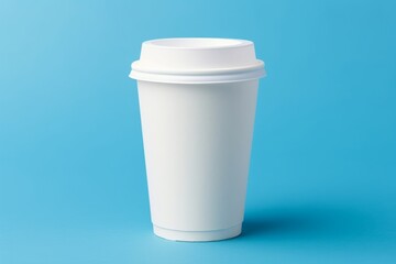 Mockup of male hand holding a Coffee paper cup isolated on light blue background.