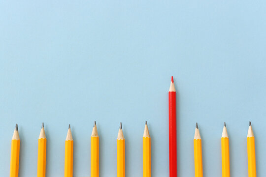 A concept image of different pencils, one is different from the others and stands out from the group