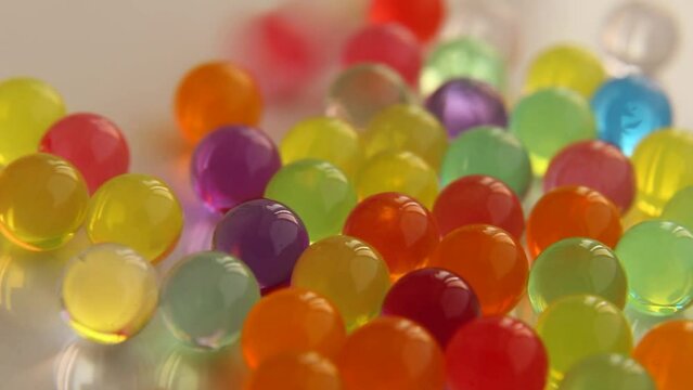 Colorful Orbeez balls are rolling. 