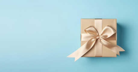 Christmas present with copy space. Gift box with golden satin ribbon and bow on blue background. AI generated