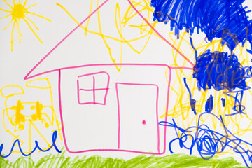 Drawing with felt-tip pens of a 6-year-old child - a house with clouds and the sun.