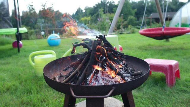 a fire pit on the patio in the backyard
