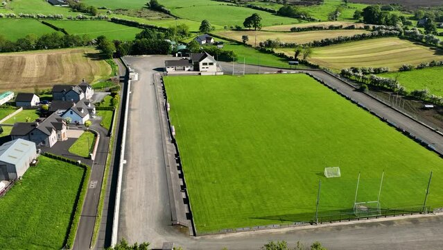 Aerial video of Loughgiel Shamrocks GAC Loughgiel village on the North Coast of Co Antrim Northern Ireland 