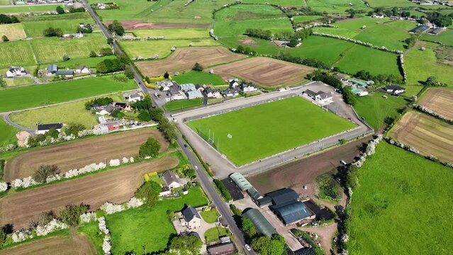 Aerial video of Loughgiel Shamrocks GAC Loughgiel village on the North Coast of Co Antrim Northern Ireland 