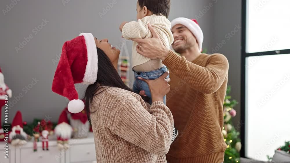 Sticker couple and son hugging each other standing by christmas tree at home