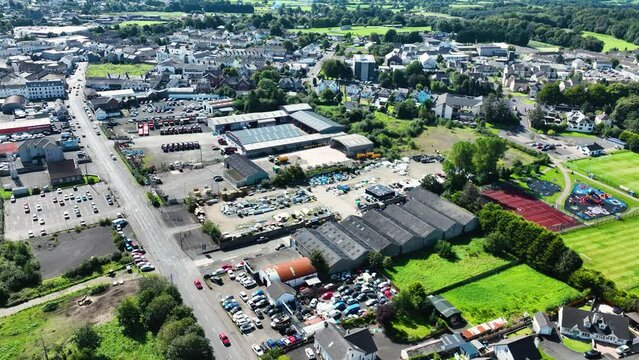 Aerial video of John McElderry Motors & Tractors LTD Steele Farm Supplies O Harrigans Garage Rudi Gage Car Sales Ballymoney Town Co Antrim Northern Ireland 