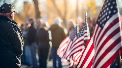 A large gathering of veterans and their families, paying tribute to those who served, with copy space, blurred background