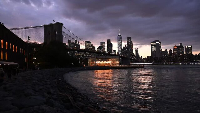 View of Manhattan island and brooklyn bridge from DUMBO at brooklyn next to the sea
