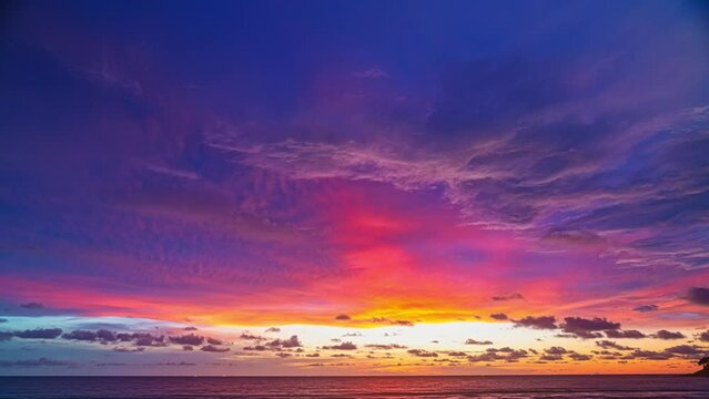 .Time lapse scene romantic pink sky on sunset above the ocean..Sunset with bright red light rays and other atmospheric effects..colorful cloud in bright sky. Sky texture abstract nature background..