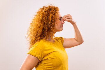 Ginger woman is having pain in sinus.