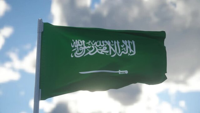 Saudi Arabia national flag waving in the wind. Green field with Shahada and sword in Thuluth script
