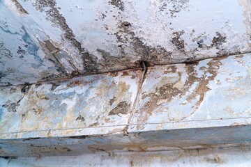 Ceiling in need of repair. On the ceiling, dirt and cracks. Selective focus. Soft focus