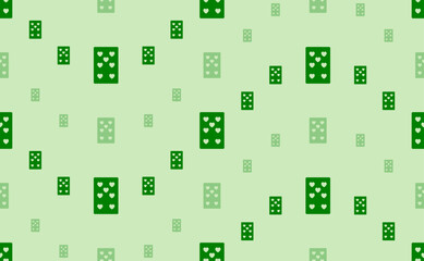 Seamless pattern of large and small green seven of hearts playing cards. The elements are arranged in a wavy. Vector illustration on light green background