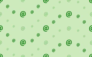 Seamless pattern of large and small green at symbols. The elements are arranged in a wavy. Vector illustration on light green background