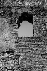 Window on a ancient stone wall, black and white photography