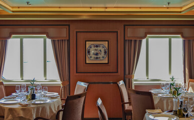 Elegant ocean view dining room a la carte restaurant onboard luxury cruiseship or cruise ship liner...