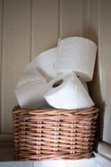 toilet paper in a basket