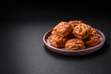 Delicious crispy mini puffs with sausage or meat with salt, thyme and sesame