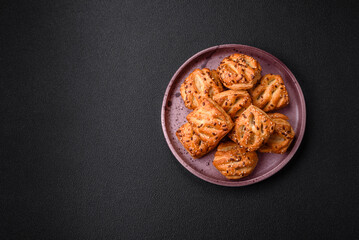 Delicious crispy mini puffs with sausage or meat with salt, thyme and sesame