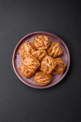 Delicious crispy mini puffs with sausage or meat with salt, thyme and sesame