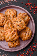 Delicious crispy mini puffs with sausage or meat with salt, thyme and sesame