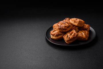Delicious crispy mini puffs with sausage or meat with salt, thyme and sesame