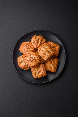 Delicious crispy mini puffs with sausage or meat with salt, thyme and sesame