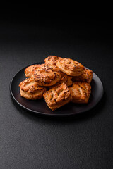 Delicious crispy mini puffs with sausage or meat with salt, thyme and sesame