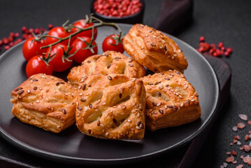 Delicious crispy mini puffs with sausage or meat with salt, thyme and sesame