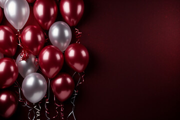 New Year's composition. Sparklers, silver confetti, festive balloons on a rich burgundy velvet surface. Flat lay, top view. Copy space. Banner backdrop