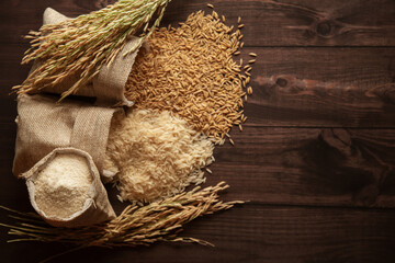Different stages of organic Rice (Oryza sativa) in a jute bag. Rice Bran, Rice, and Rice Flour on a...