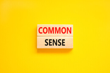 Common sense symbol. Concept words Common sense on beautiful wooden block. Beautiful yellow table...