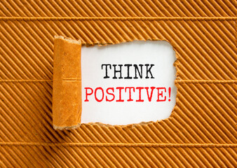 Think positive symbol. Concept words Think positive on beautiful white paper. Beautiful brown paper...