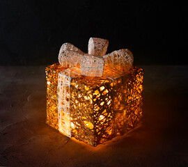 Decorative garland gift box on a dark background
