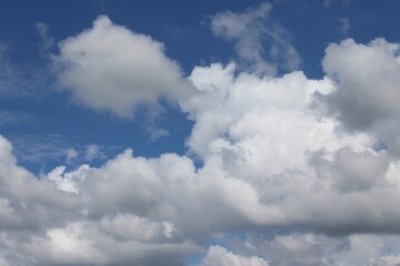 Naklejka na ściany i meble Blue Sky with Bright White Cumulous Clouds