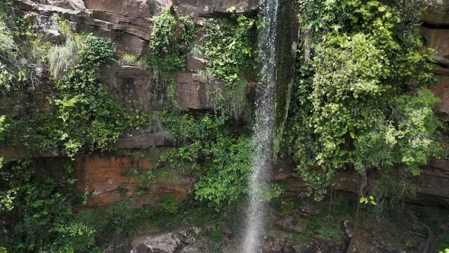 Drone footage of the scenic waterfall Chorro San Luis embedded in a thick, tropical forest near Robor&eacute; in the lowlands of Bolivia - Traveling and exploring South America - natural look