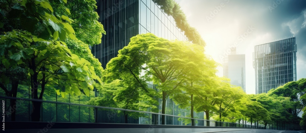 Wall mural green concept highlighting an eco friendly building with a vertical garden and trees in a modern cit