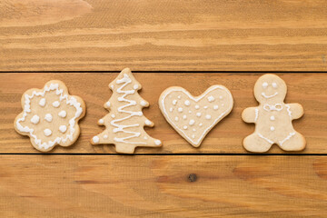 Cute homemade Christmas cookies on wooden background,top view
