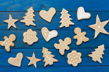 Cute homemade Christmas cookies on wooden background,top view