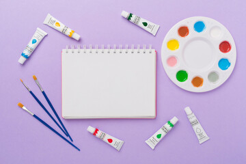 Painting tools on color background, top, view