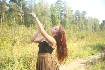 Young pretty woman in the field