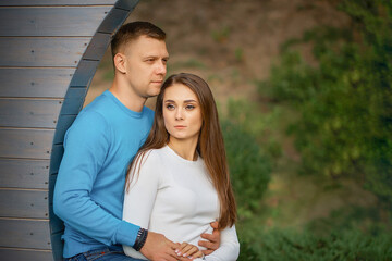 Fototapeta premium Photo of young attractive gentle sweet amorous affectionate couple cuddling enjoying rest romance outdoors