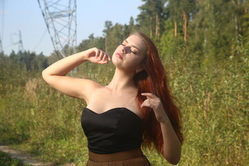 Obraz premium Young pretty woman in a dress