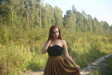 Young pretty woman in a field
