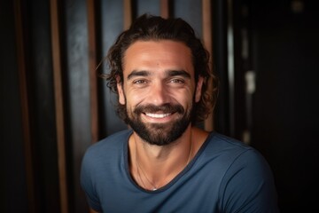 Smiling bearded mediterranean man looking at the camera 
